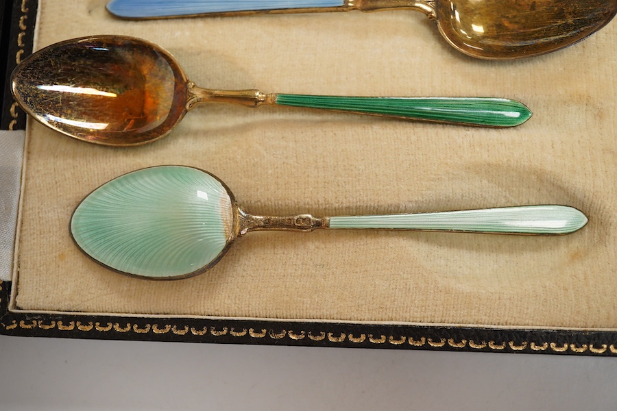 A cased set of six early 1950's silver gilt and polychrome enamel coffee spoons by Suckling Ltd (enamel a.f.). Condition - poor to fair